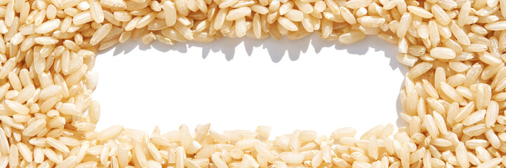 A rectangle frame captures a heap of brown basmati rice on a white background. The texture of long grains symbolizes nutrition and healthy cuisine, addressing hunger and poverty. Banner
