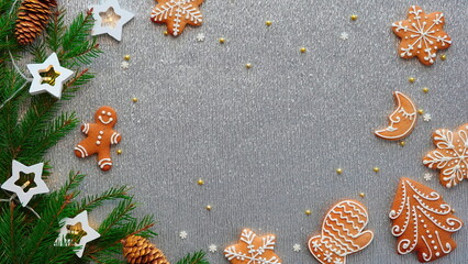 Festive Christmas Background with Gingerbread Cookies and Pine Decor