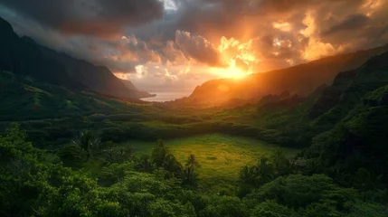 Fotobehang Vibrant sunset amidst lush green hawaiian valley under moody sky - nature's serenity © Ashi
