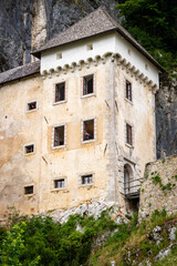 Fototapeta na wymiar Predjama Castle, Predjamski grad or Grad Predjama » Postojna Cave Park stone castle embedded in the mountain Slovenia