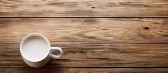 Fototapeta na wymiar Morning Delight: Aromatic Coffee Cup Resting on Rustic Wooden Table