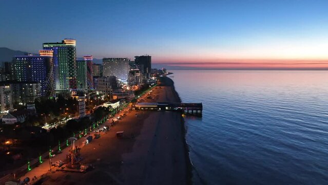 Flying over modern luxury hotel Colosseum Marina on Sherif Khimshiashvili street. Batumi, Georgia 2024 spring