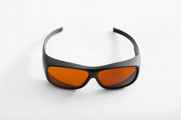 Safety glasses for cosmetologists, doctors to work with laser, isolated on a white background