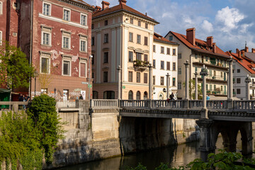 Ljubljana, Slovenia; Beautiful buildings along the promenade of the navigable Ljubljanica river in...