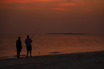fishing at sunset