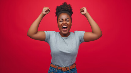 Fototapeta premium jubilant woman with her arms raised in a celebratory victory pose