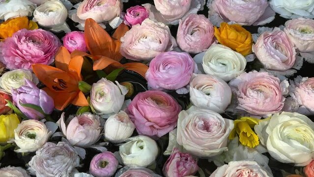 Beautiful flowers roses, lily, hyacinth, ranunculus, herbera pink white yellow petals.