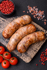 Grilled sausages with spices and herbs. With copy space
