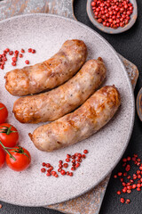 Grilled sausages with spices and herbs. With copy space