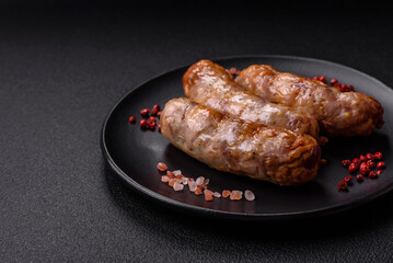 Grilled sausages with spices and herbs. With copy space