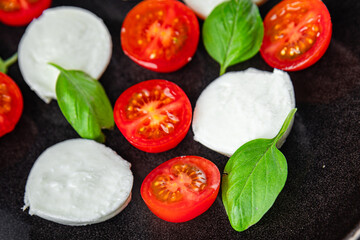 mozzarella salad caprese tomato, basil fresh food tasty eating appetizer meal food snack on the...