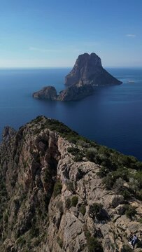 The island of Es Vedra and Pirates Tower. Vertical video.