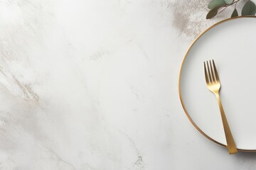 A simple image of a gold fork on a white plate. Suitable for food and dining concepts