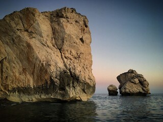 Petra tou Romiou or Aphrodite's Rock in the Mediterranean Sea near Koúklia, Paphos, Cyprus,...
