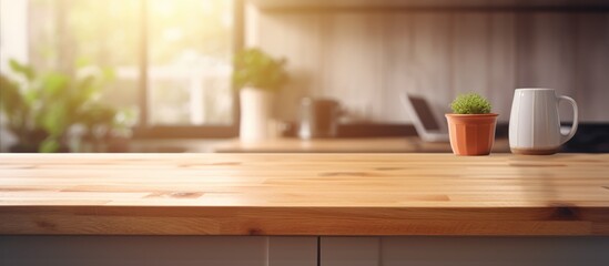 Fototapeta na wymiar Wooden desk space on a blurred kitchen bench background.