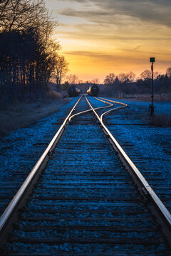 Railway tracks during a golden sunset
