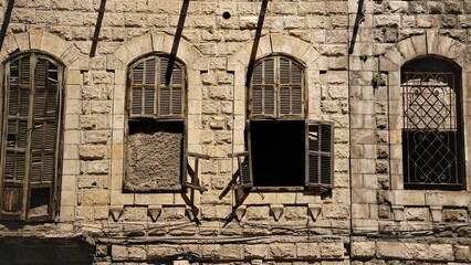 old windows in weathered facade as background