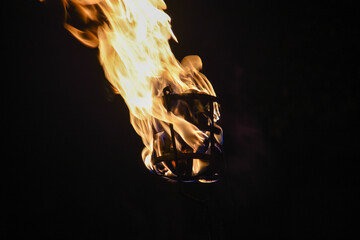 Flames of a coppara torch that lighting in Kandy Esala Perahera at Temple of the Tooth (Sri Dalada Maligawa), Kandy, Sri Lanka. - obrazy, fototapety, plakaty