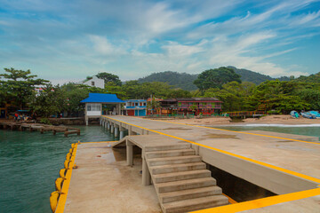 Dock to go to Calado beach with blue sky. Colombia. 