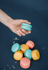 The image is of a hand holding a colorful pill 6225.