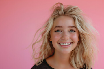 Beauty portrait of young blond teenage girl (woman) with nice makeup on pink background 14 years old