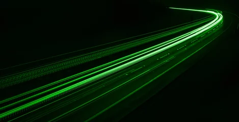 Papier Peint photo Lavable Autoroute dans la nuit green car lights at night. long exposure