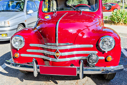 Igualada, Barcelona, Spain; October 1, 2023: Red Renault 4CV (RNUR) classic vehicle exposed on the road. vintage, old