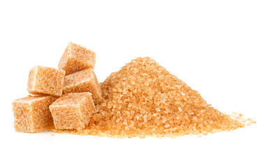 Pile of brown granulated sugar and sugar cubes isolated on a white background. Unrefined brown cane sugar pile. - 758269558