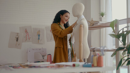 Dressmaker working in fashion design studio
