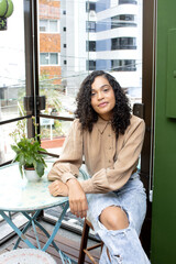 Portrait of a brazilian woman indoors at home