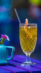 red and yellow cocktail on table outdoor