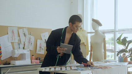 LGBTQ Designer working in fashion design studio