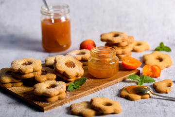 Apricot cookies. Menu concept. Freshly baked cookies with apricot jam on a light background