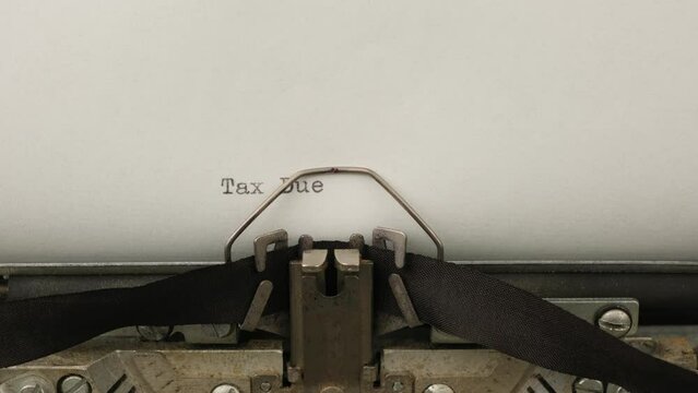 typing Tax due on a vintage typewriter close-up