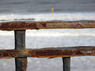 Rusty fence with north sea in the background - Beach esplanade - Aberdeen - Scotland - UK