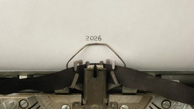 typing numbers 2026 on a vintage typewriter close-up