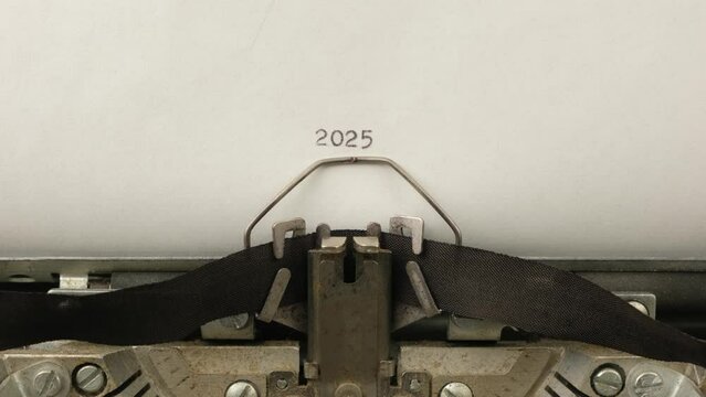 typing numbers 2025 on a vintage typewriter close-up