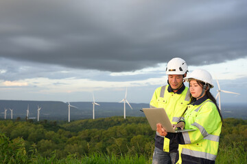 Wind turbine engineer technician male team working service maintenance survey construction site....