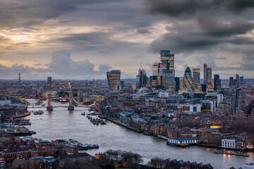 Panoramic view of the 2024 skyline of London with City, Tower Bridge and skyscrapers during a moody evening with clouds