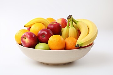 A detailed shot showcasing a colorful fruit bowl filled with an assortment of ripe fruits, such as apples, bananas, and oranges, against a clean white surface