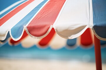 A detailed shot capturing the texture of a beach umbrella, its sturdy frame and bright fabric providing shade on hot days