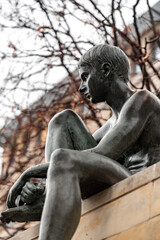 Fototapeta na wymiar Bronze sculpture of Three Girls and a Boy on the bank of Spree River, Berlin, Germany