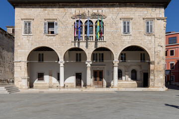 Fototapeta na wymiar Communal Palace located on the Forum Square, in the center of the city, Pula, Croatia, Istria