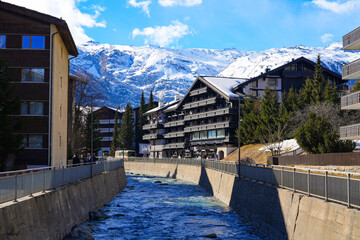 Matter-Vispa river of glacial melt water in the luxury car-free ski resort of Zermatt in the Canton...