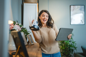 One woman use digital tablet to adjust install home security camera