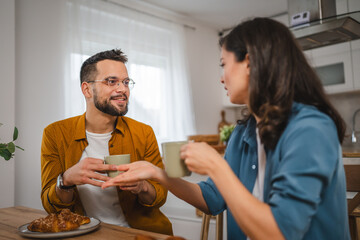 Adult couple have breakfast and cup of coffee at home morning routine