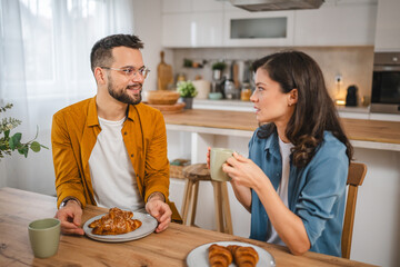 Adult couple have breakfast and cup of coffee at home morning routine