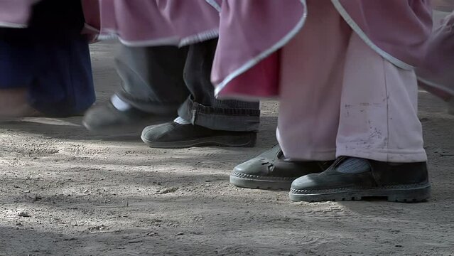 Young Primary School Children Dancing a Chacarera Folk Dance that Originated in Santiago del Estero Province, Argentina. Low Angle View. 4K Resolution.