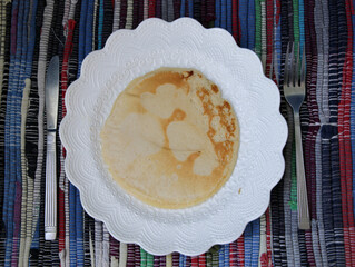 pancake with hearts on it, on white plate