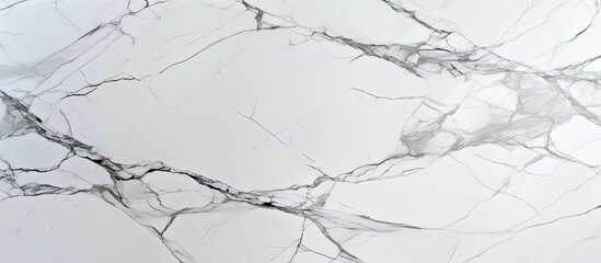 Fototapeta premium A closeup of a monochrome white marble texture on a freezing winter slope, resembling a snowdusted landscape pattern